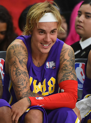 LOS ANGELES, CA - FEBRUARY 16:  Canadian singer and songwriter Justin Bieber sits on the bench during the 2018 NBA All-Star Game Celebrity Game at Los Angeles Convention Center on February 16, 2018 in Los Angeles, California.  (Photo by Jayne Kamin-Oncea/Getty Images)